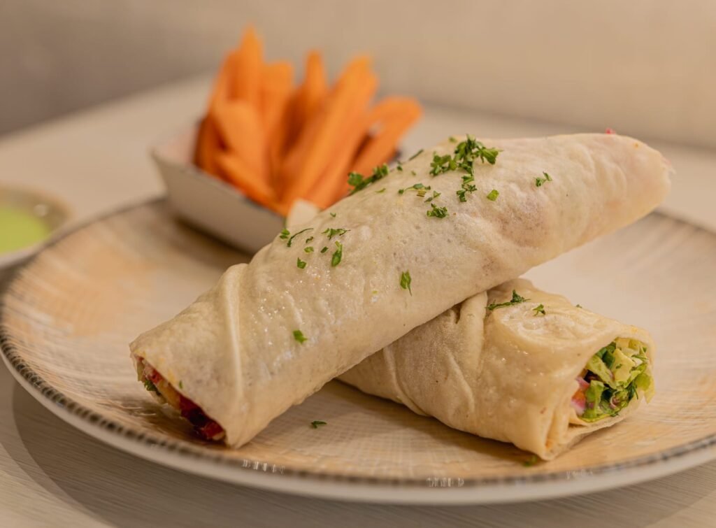Turkish shawarma style roll served on plate at Kebab House Bhutani Alphathum Noida