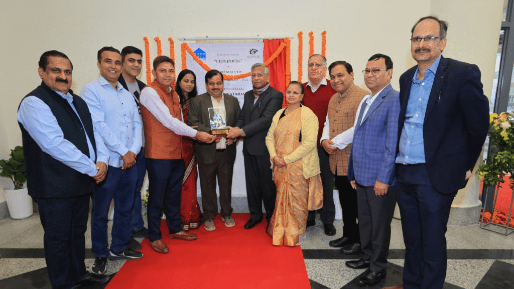 NBCC leadership, Court Receiver committee members and resident representatives on stage during the Heart Beat City Club House-cum-Community Centre launch event in Noida