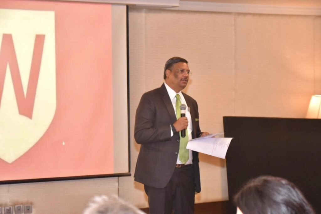 Speaker addressing delegates at the Western Sydney University and GNIDA Greater Noida campus announcement event