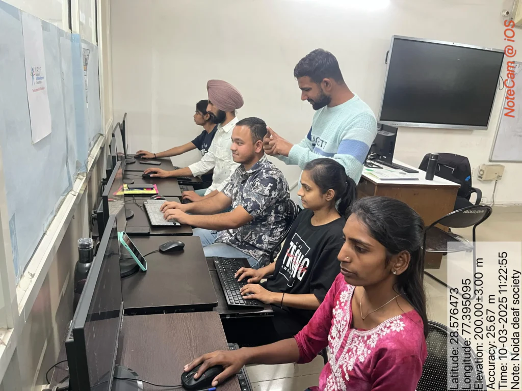 Students attend a computer training session at Noida Deaf Society in Noida.