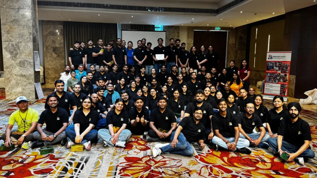 Team members and supporters of Noida Deaf Society during a group event.