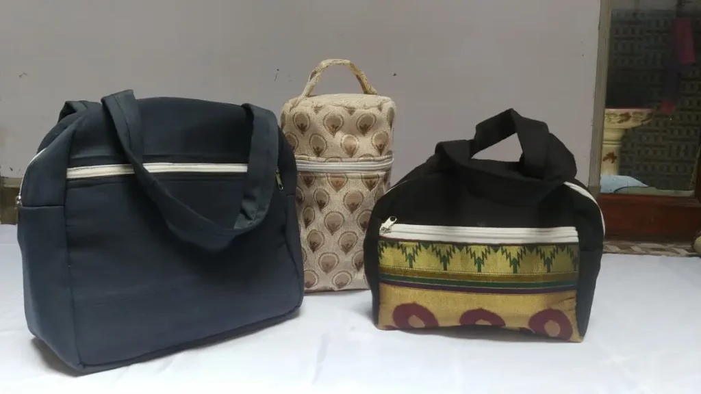 Lunch bags made from reused sarees and upholstery material by women in Noida