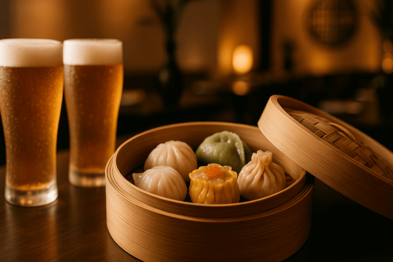 Assorted dim sums in bamboo steamer paired with craft beer glasses at Chao Bella, Crowne Plaza Greater Noida