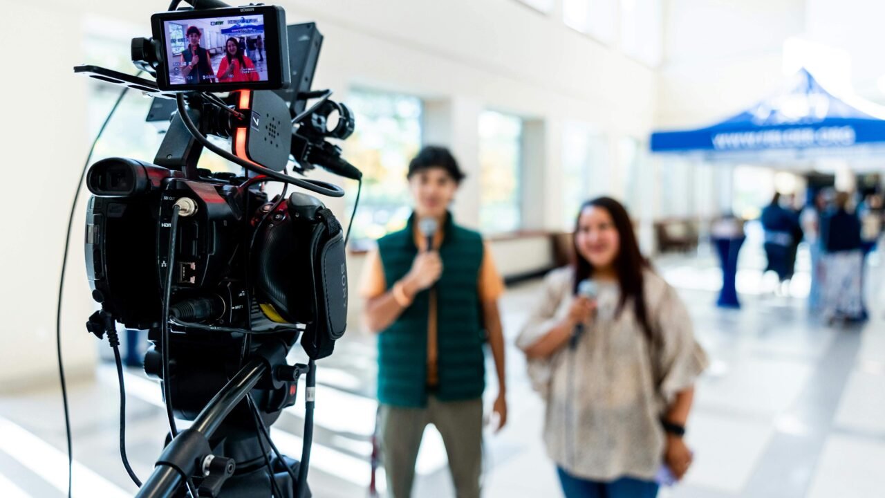 TV camera filming media professionals during an interview at Noida Film City, India’s media and entertainment hub