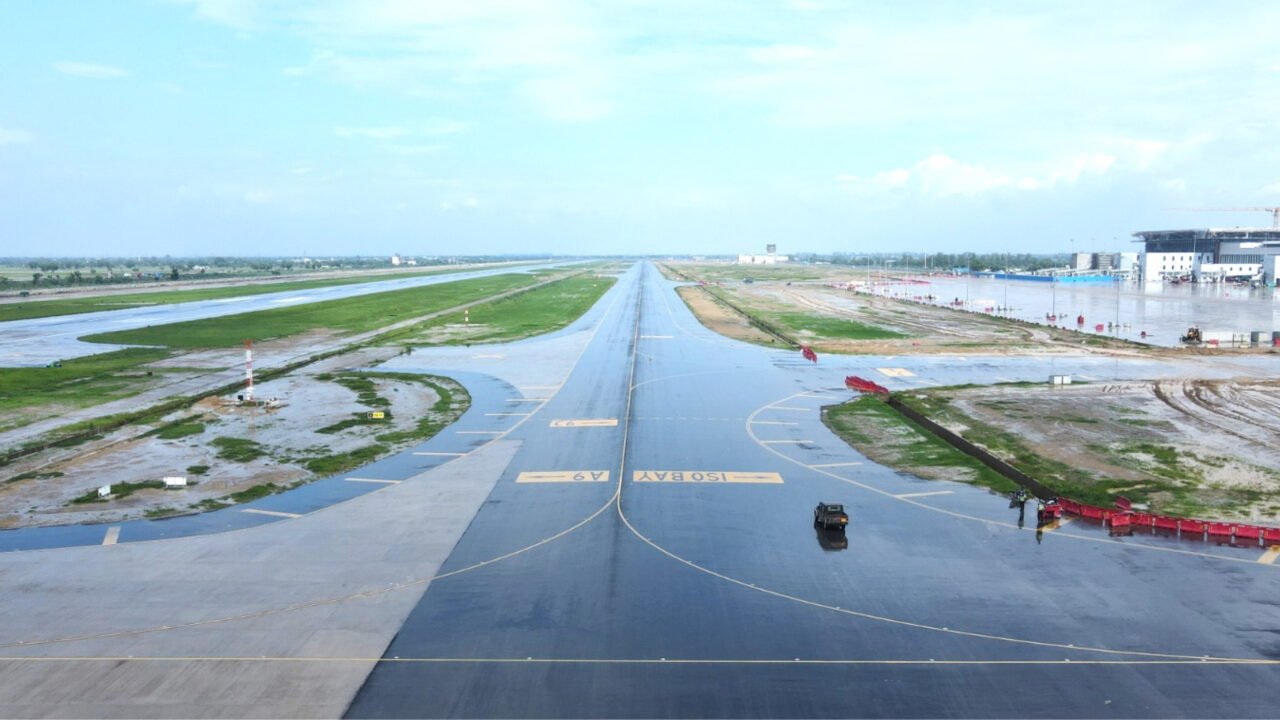 Airplane taking off representing the inaugurated Phase 1 of Noida International Airport in Jewar, announcing commercial flights starting April to May 2026.
