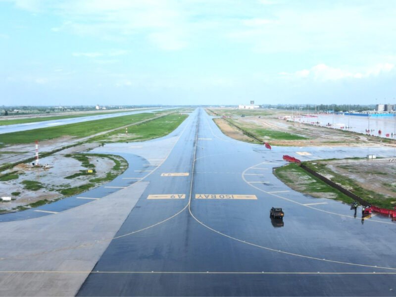 Airplane taking off representing the inaugurated Phase 1 of Noida International Airport in Jewar, announcing commercial flights starting April to May 2026.