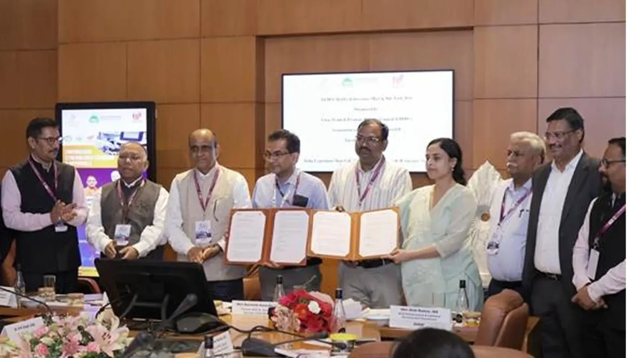 Officials display the signed IPC–UPPPC MoU during the YEIDA MedTech Investors Meet at India Expo Mart, Greater Noida