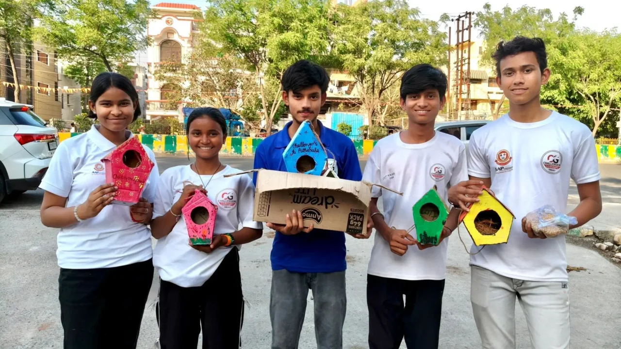 Students from Challengers Group Trust display bird shelters and feeders made from reused materials in Noida