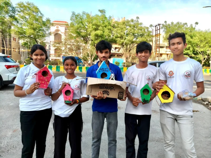Students from Challengers Group Trust display bird shelters and feeders made from reused materials in Noida