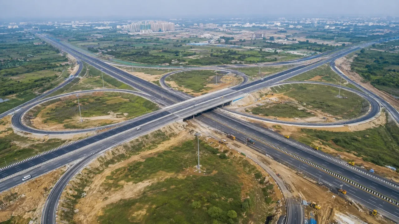 AI-generated aerial view of a cloverleaf interchange connecting two expressways near Greater Noida