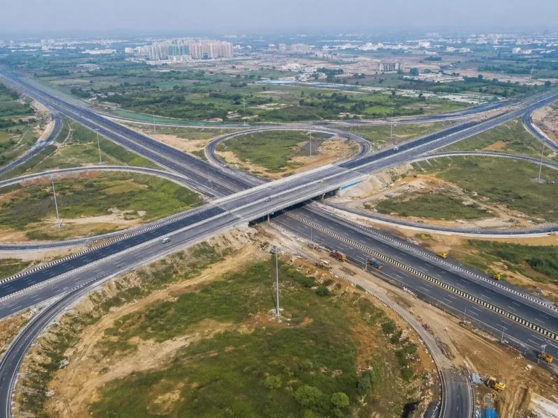 AI-generated aerial view of a cloverleaf interchange connecting two expressways near Greater Noida