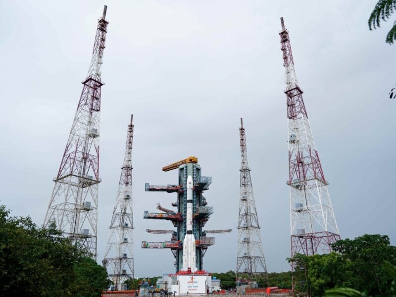 ISRO's GSLV-F18 rocket carrying the NVS-03 NavIC navigation satellite at the Sriharikota launch pad, surrounded by four lightning protection towers.