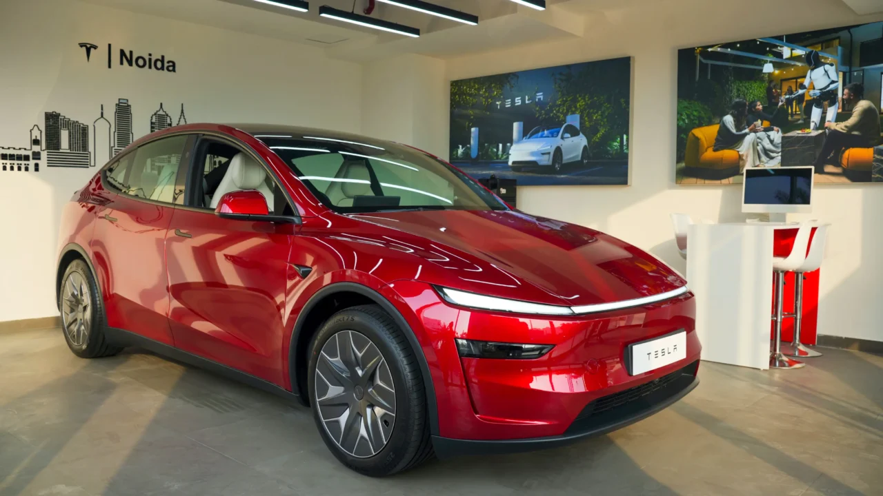 Red Tesla electric SUV on display at the Skymark One showroom in Noida