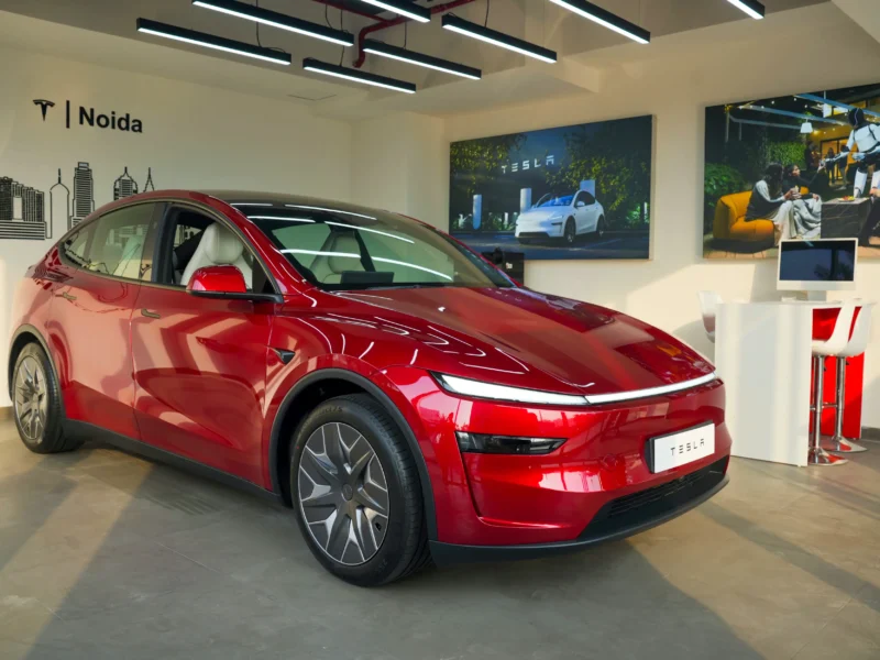Red Tesla electric SUV on display at the Skymark One showroom in Noida